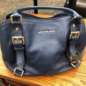 Michael Kors blue bag.